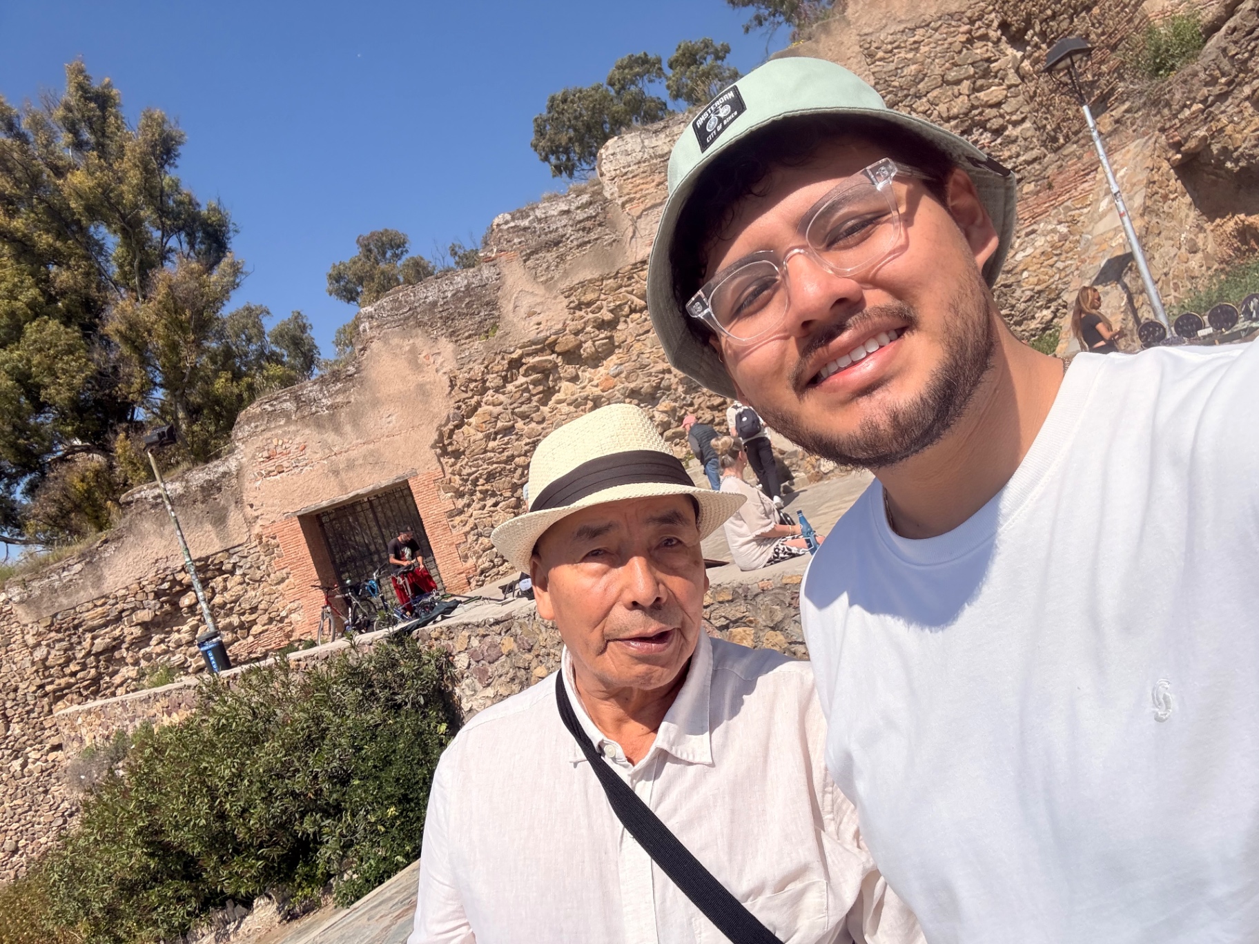 Chris Guzaro and his grandfather Santos Mendoza at stone ruins in Málaga, Spain